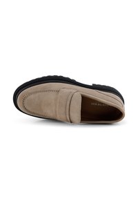 Beige suede loafer with a moccasin-style design, featuring a raised seam and black rubber sole for traction.