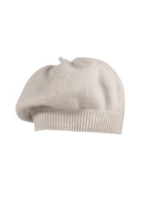 Light beige knitted beret hat with a soft, textured surface and a ribbed band at the base. Features a small top knot detail.