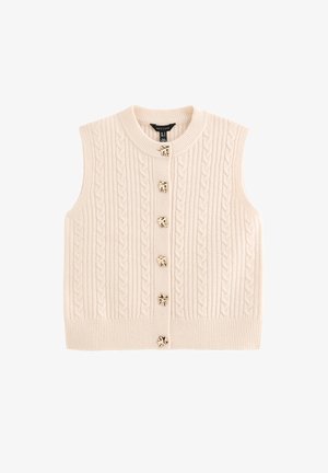 Maglione smanicato a trecce color crema, con scollo rotondo e sei bottoni tono oro sul davanti. Orlo a coste con texture.