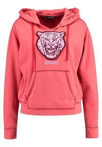 Koraalroze hoodie gemaakt van katoen. Heeft een met bont gevoerd tijgerafbeelding op de voorkant, een capuchon met trekkoord en een voorzak.