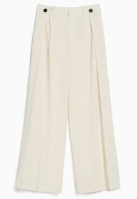 Wide-leg trousers in cream fabric with two front pleats, featuring two black buttons at the waistband for closure.