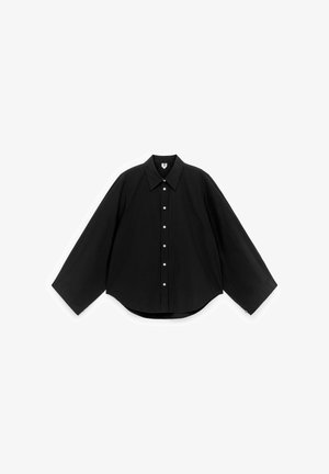 Black button-up shirt with a pointed collar, long sleeves, and rounded hem. Lightweight fabric with button closure and textured surface.