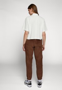 Nike Sportswear Trainingsbroek - brown ale brown