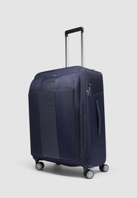 Marineblauer Hartschalenkoffer mit strukturierter Oberfläche, verstellbarem Teleskopgriff, Doppelrollen und Seitenhandgriff für einfachen Transport.