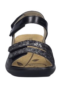 Mustat sandaalit, joissa on kolme säädettävää hihnaa, kuvioitu päällinen ja pehmustettu sisäpohja, jossa on lehtikuvio. Muotoutuva kumipohja.