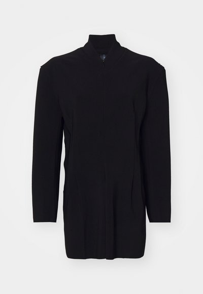 Black, long-sleeve garment with a high collar, featuring a zip closure and structured seams for a tailored fit. Smooth texture, minimal design.