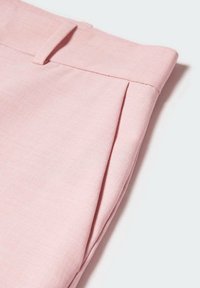 Light pink tailored trousers featuring subtle pleats, smooth texture, and a classic waistband closure. Ideal for casual or formal wear.