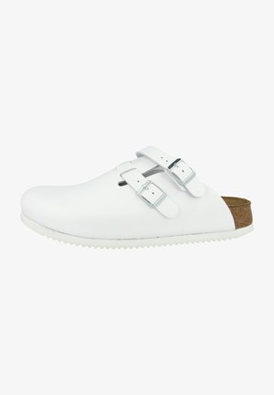 White clogs with silver buckles, curved toe, and textured sole. Made of sleek material with a cork accent on the heel.