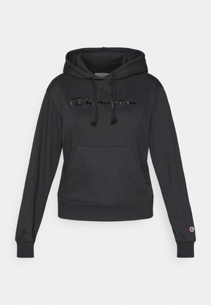 Svart pullover-hoodie i mjukt tyg, med en kanguruficka framtill, justerbara dragsnören och broderad "Champion"-logotyp.