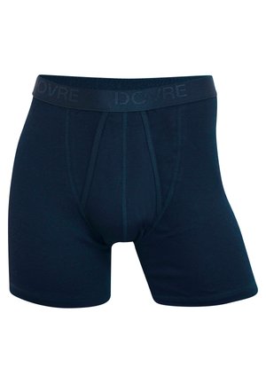 Mørkeblå bokser-shorts laget av myk, elastisk stoff. Har en logo-linning og kontraststing med en tett passform og midt-lår lengde.