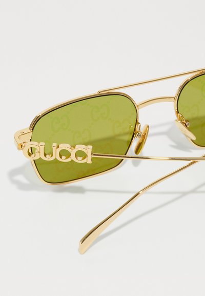 Gucci UNISEX - Slnečné okuliare - gold-coloured