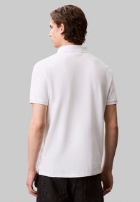 Calvin Klein Jeans Polo shirt - blanc de blanc