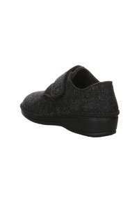 Gray felt slipper with a black rubber sole, featuring a curved design and a hook-and-loop closure for easy wear. Smooth texture overall.