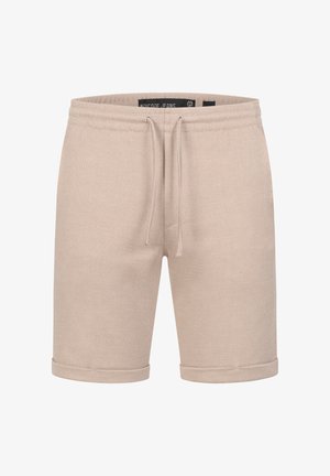 Beige cotton blend shorts with textured fabric, drawstring waist, and rolled hems. Simple design without pockets or additional accents.