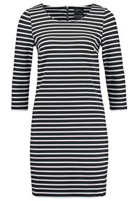 Robe à rayures noires et blanches avec manches trois-quarts, encolure dégagée et fermeture éclair au dos. Fabriquée en tissu extensible et texturé.