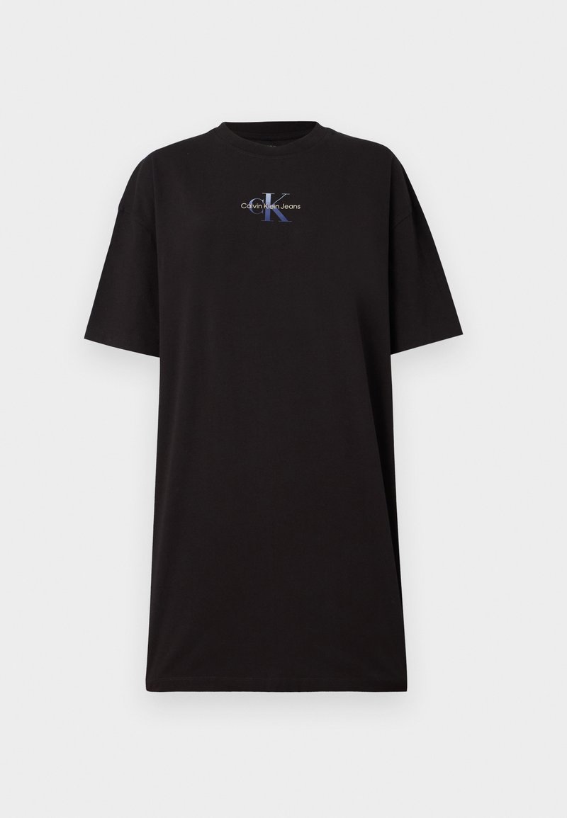 T-shirt noir surdimensionné en coton. Il dispose d'un col rond et de manches courtes. Affiche un logo graphique en bleu et blanc sur le devant.