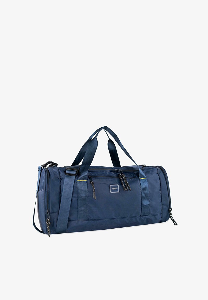 Bolsa de deporte azul marino con material de nailon suave, doble asa en la parte superior, correa de hombro ajustable, bolsillo frontal con cremallera y parche con el logo.