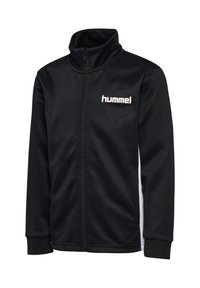 Schwarze Jacke mit Reißverschluss und hohem Kragen aus glattem Stoff. Verfügt über weiße Seitenpaneele und ein dezentes "hummel"-Logo in Creme.
