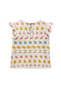 Haut à manches courtes de couleur claire avec un imprimé de fruits en rouge, jaune, bleu et vert, dos échancré avec un trou en forme de goutte et manches volantées.