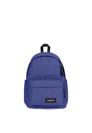Purple nylon backpack with rounded top, front zip pocket, and black logo patch. Features black zipper pulls and a sturdy top handle.
