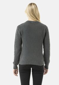 Gray knitted sweater featuring a textured body, ribbed cuffs and hem, and cable-knit accents along the sleeves, designed for a fitted look.