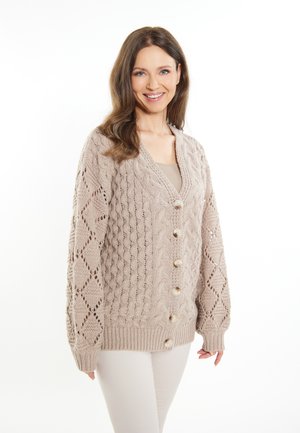 Gebreide cardigan in lichtbeige, met gemêleerde patronen en een knoopsluiting. Lange mouwen met openwerk details.