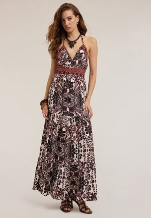 Maxi-jurk met halterneck, met een zwart-wit bloemenpatroon, rode accenten op het lijfje en een gelaagde rok.
