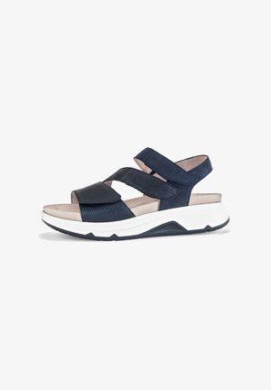 Navy blue sandals with a textured, ribbed strap and two velcro closures. Cushioned footbed on a contrasting white and navy sole.