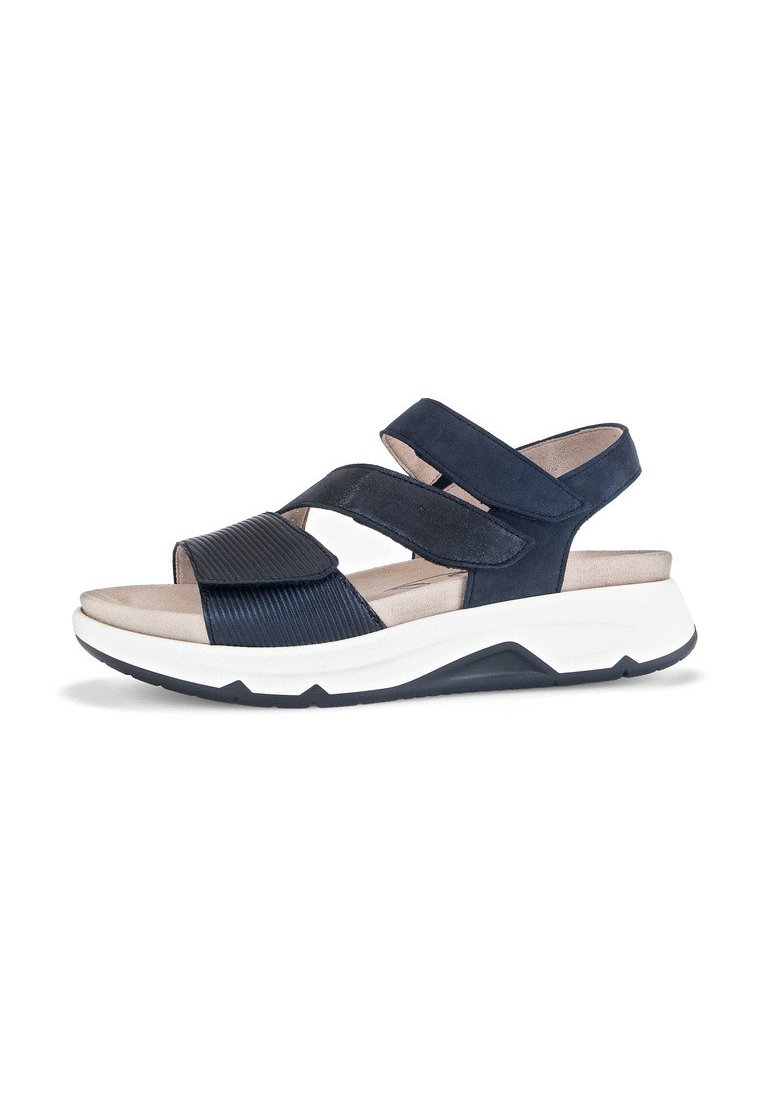 Navy blue sandals with a textured, ribbed strap and two velcro closures. Cushioned footbed on a contrasting white and navy sole.