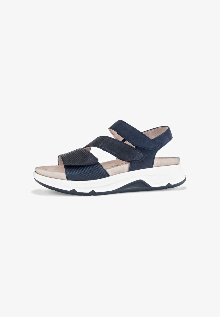 Navy blue sandals with a textured, ribbed strap and two velcro closures. Cushioned footbed on a contrasting white and navy sole.