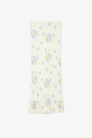 Lightweight cream dress featuring a playful pattern of blue oysters and yellow lemon slices. Smooth texture with a flared hem.