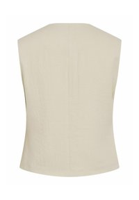 Beige ilmanhihaista toppia, joka on valmistettu kevyestä kankaasta. Tässä on siisti takapaneeli, jossa on hienovarainen rakenne ja muotoiltu malli.