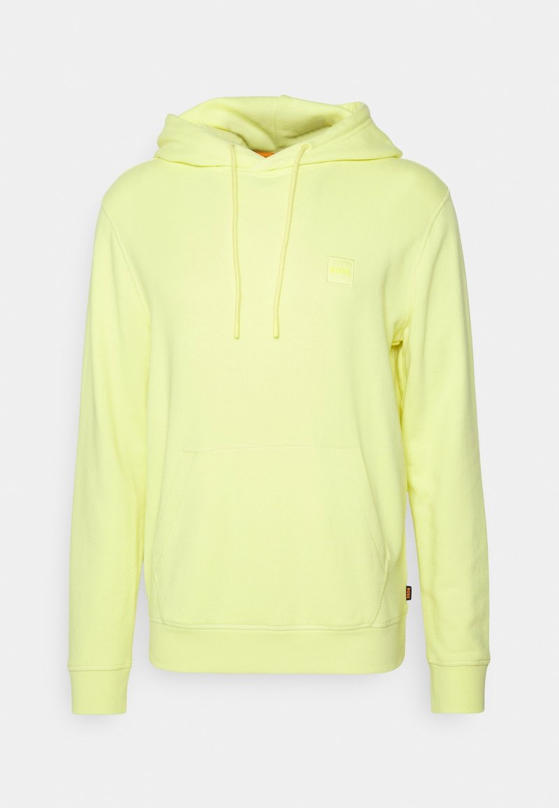 Heldere gele hoodie van zacht materiaal, met een voorzak, een capuchon met trekkoord en een vierkant logo op de borst.