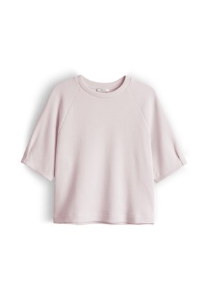 Light pink short-sleeve crew neck textured shirt with raglan sleeves and a straight hem, displayed flat on a white background.