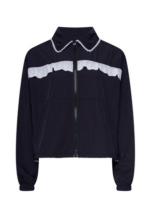 Schwarze, langärmelige Jacke mit Reißverschluss, weißer Spitzenverzierung über Brust und Kragen, elastischen Bündchen und leicht gekürztem Saum.