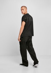 Urban Classics T-shirt print - schwarz