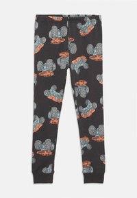 Leggings noirs avec un motif répété de camions monstres colorés en bleu et orange. Fabriqués en tissu coton doux et extensible.
