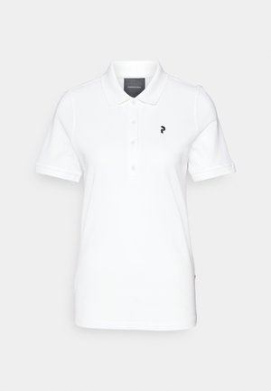 Valkoinen polo-paita, joka on valmistettu sileästä kankaasta, klassisella kauluksella ja lyhyillä hihoilla. Musta logo vasemmalla rinnassa. Napit edessä.