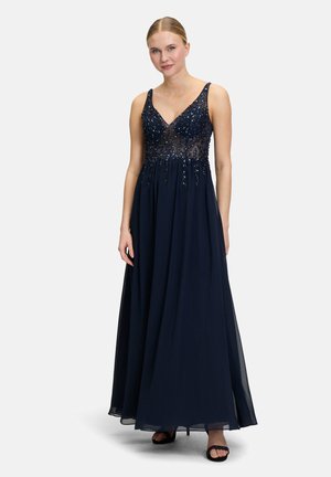 Navyblaues Abendkleid mit einem enganliegenden, bestickten Oberteil, V-Ausschnitt und fließendem Rock. Mit schmalen Spaghetti-Trägern und einer leicht A-Linien-förmigen Silhouette.