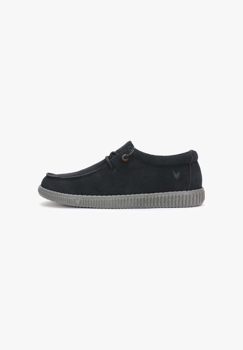 Black suede casual shoe with gray ridged sole, lace detail near the ankle, and a small embossed logo on the side.