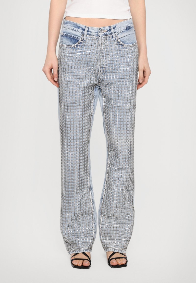 Light blue denim trousers with a silver geometric pattern, straight-leg design, and decorative stitching; features two front pockets.