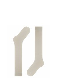 Beige Socken mit einem Gittermuster, ausgestattet mit einem gerippten Bündchen und glatter Textur. Eine Socke hat eine abgerundete Zehenform, während die andere eine längere Form aufweist.