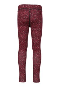 Rode leggings met een zwart hartpatroon, voorzien van een elastische tailleband en een gladde, rekbare stof, ontworpen voor comfort en flexibiliteit.