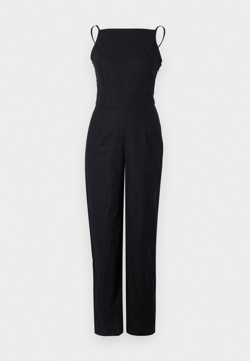 Black linen jumpsuit with thin shoulder straps, fitted bodice, and straight-leg design. Features minimal seam detailing and a smooth texture.