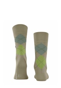 Beżowe skarpetki z wzorem argyle w odcieniach zieleni i niebieskiego, wykonane z teksturowanego materiału dzianinowego. Wzmocnione mankiety i palce.