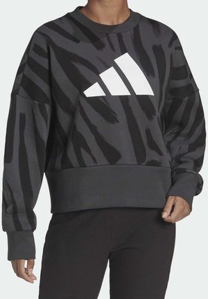 Felpa nera con motivo a strisce di tigre grigie, con polsini larghi, design accorciato, caratterizzata da un grande logo bianco Adidas sul davanti.