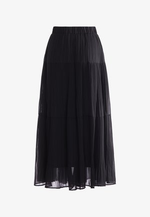 Longue jupe noire plissée avec des couches superposées et une taille élastique, en tissu léger semi-transparent.
