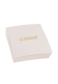Square, pale pink box with a smooth surface. The lid features the word "amor" in gold lettering. Subtle texture around edges.
