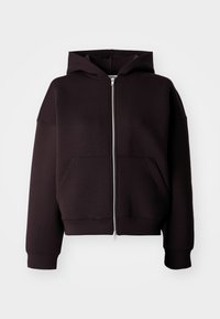 Sort zip-up hettegenser laget av mykt stoff. Har en kortere passform, romslige lommer og en stor hette. Glatt tekstur med ribbede mansjetter.