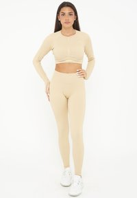 BURNER - Leggings - Pantaloni - sabbia